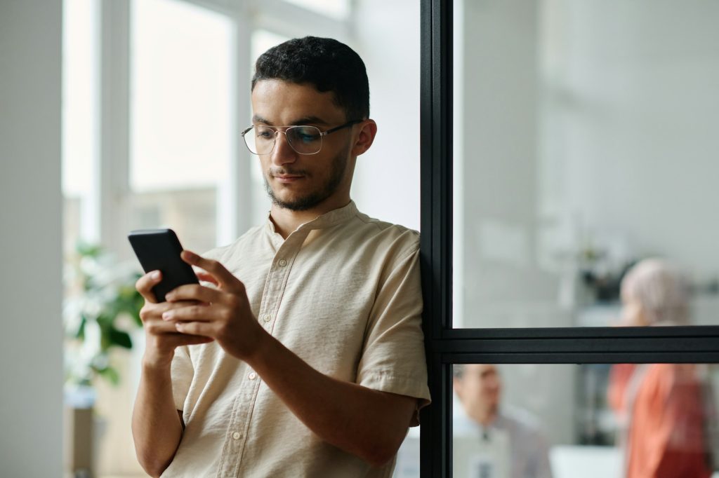 Manager looking at smartphone screen